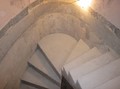 Central section of the stair with curved wall and treads