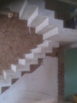Concrete stair with zigzag soffit detail, i metre wide and half landing