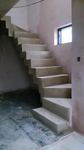 Finished, 900 mm wide concrete stair with zigzag style soffit.