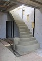 bespoke concrete  stair, varying widths and round steps