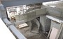 Huge spiral concrete stair with slid concrete balustrade