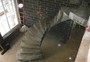 Twisting stair with small landing and bul nose detail at the base