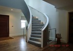 Concrete helical stairs with solid concrete balustrade