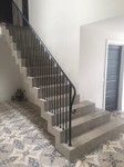 Polished concrete stairs with stepped soffit