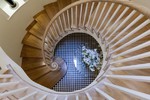 Helical staircase with wooden treads and risers