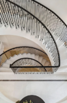 Concrete helical stairs finished with marble