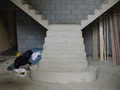 A T-shaped concrete stairs with curved edges