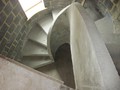 A helical concrete stairs with solid concrete balustrade