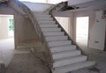 A T-shaped concrete stairs with closed string